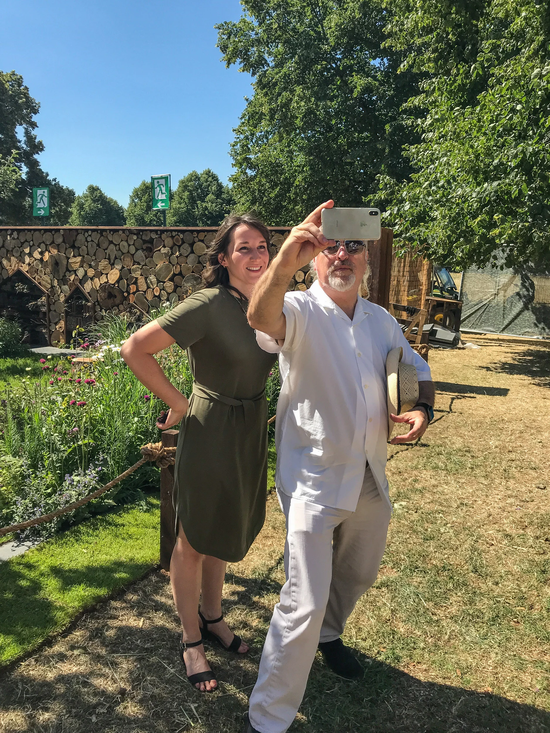 Bill Bailey at Hampton Court Flower Show grabbing a selfie with designer Lilly Gomm