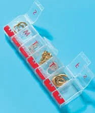 A selection of different pill cases can be used to store earrings and rings. Either a standing tube style (left), or the long one (above), or both! These can be found super cheap at any drug store. 