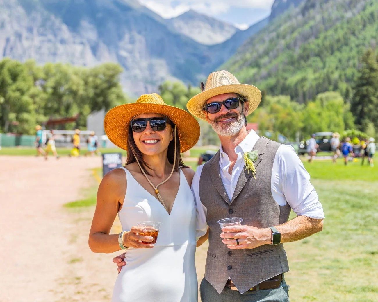 A couple enjoying drinks in Town Park for Telluride Jazz Festival.