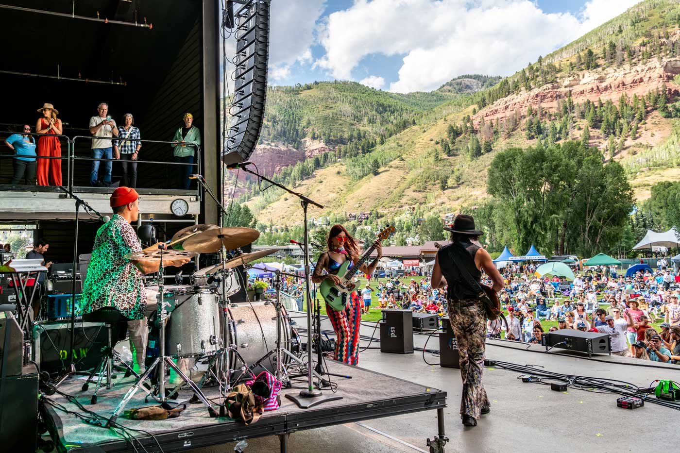Band performing on stage at Telluride Jazz Festival with the San Juan Mountains in the background