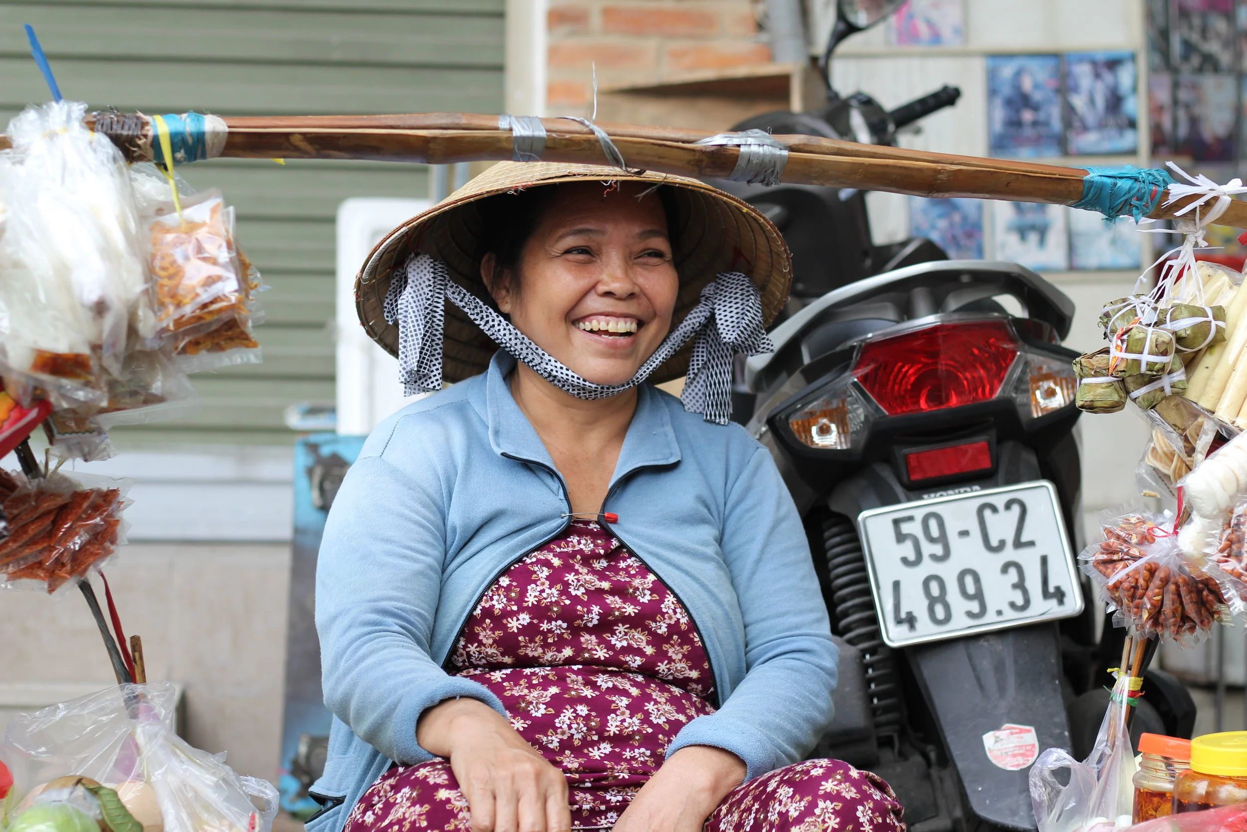 A friendly street vendor, saving me from my afternoon hunger in Ho Chi Minh City.