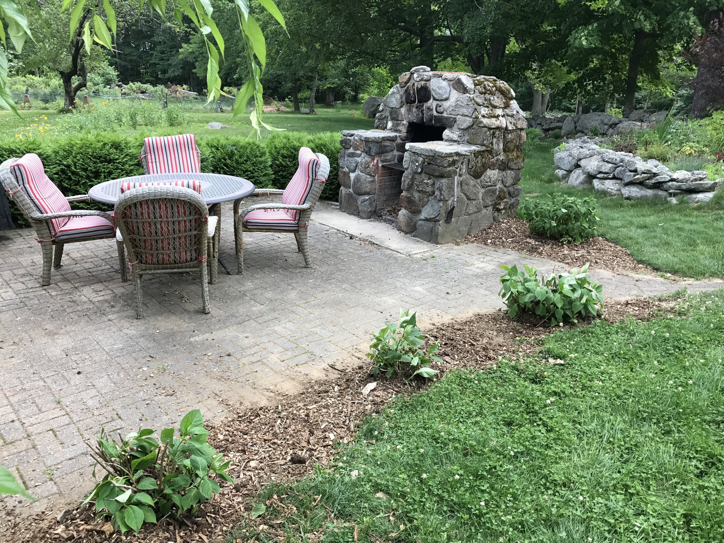 Patio with outdoor fireplace that is available for guests
