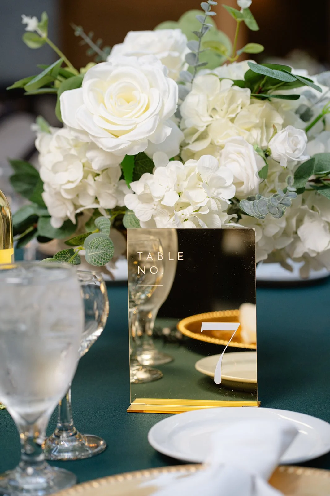 low-centerpieces-and-gold-table-number.jpg