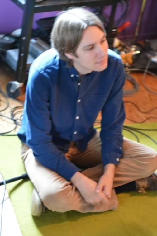 Tim crosslegged on floor*.JPG