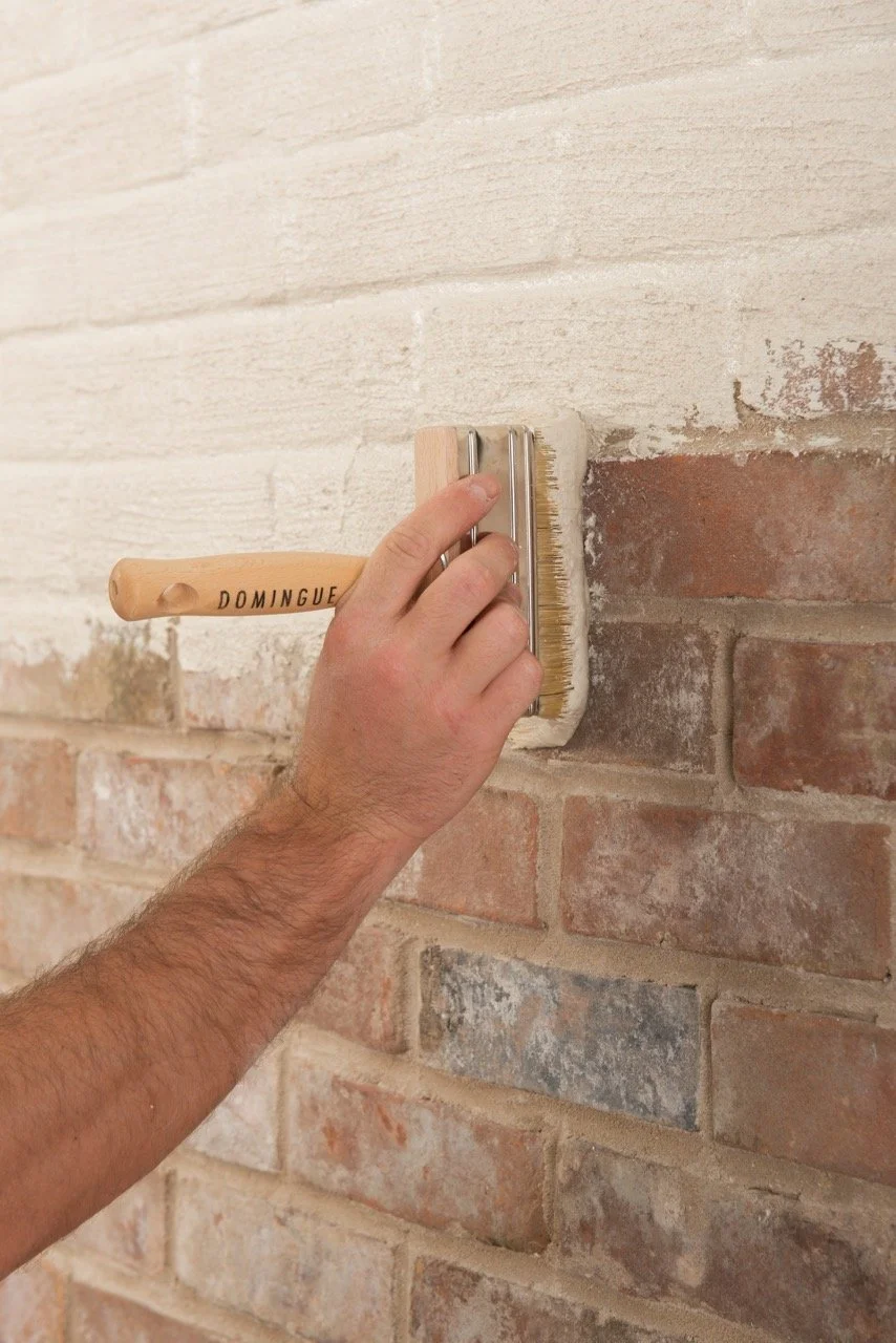 at work_plaster slurry on brick.jpg
