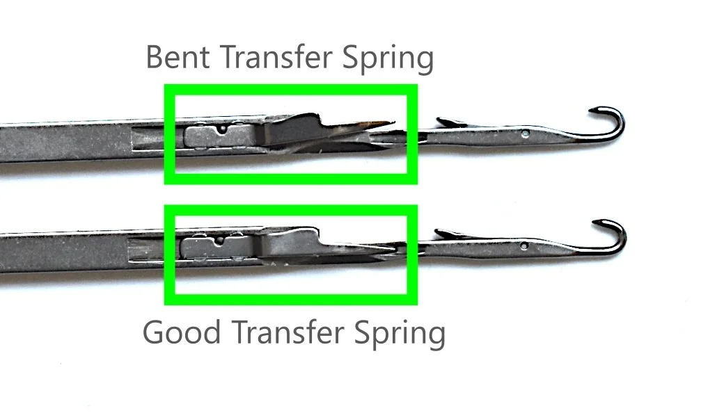 2 knitting machine needles with text indicating a benttransfer spring on one and a good transfer spring on the other