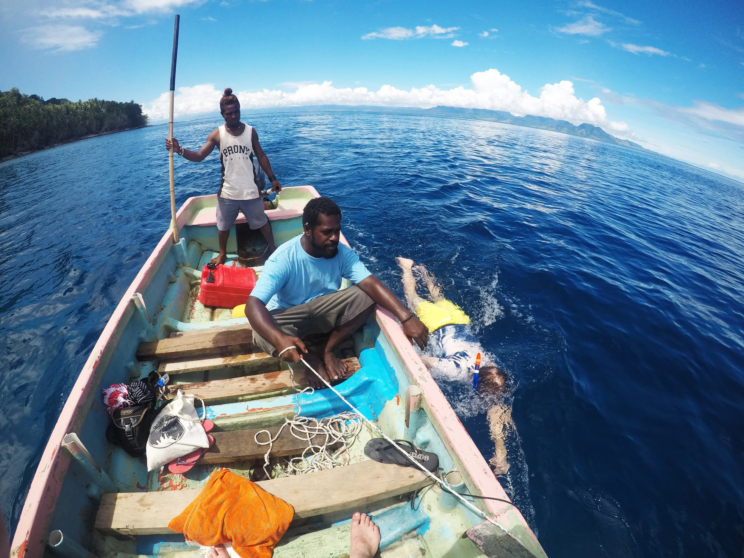 Gordon under tow: My ship-mate getting dragged along side the banana boat under the watchful-eye of our guides.