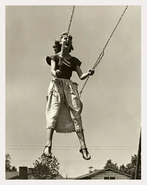 woman on swing with border.jpg