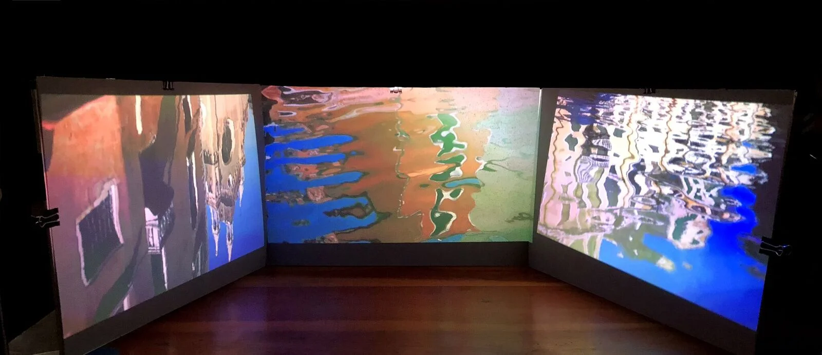 Reflections (model), 2018. Video installation triptych on unstretched canvas. Image via CURRENTS NEW MEDIA.