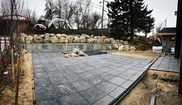 SHADES OF GREY:
This outdoor living and pool area are beginning to take shape! Wait until you see the shades of grey being incorporated in everything from the pavers to the pool plaster and tile and even the stone veneer. This is going to look amazin