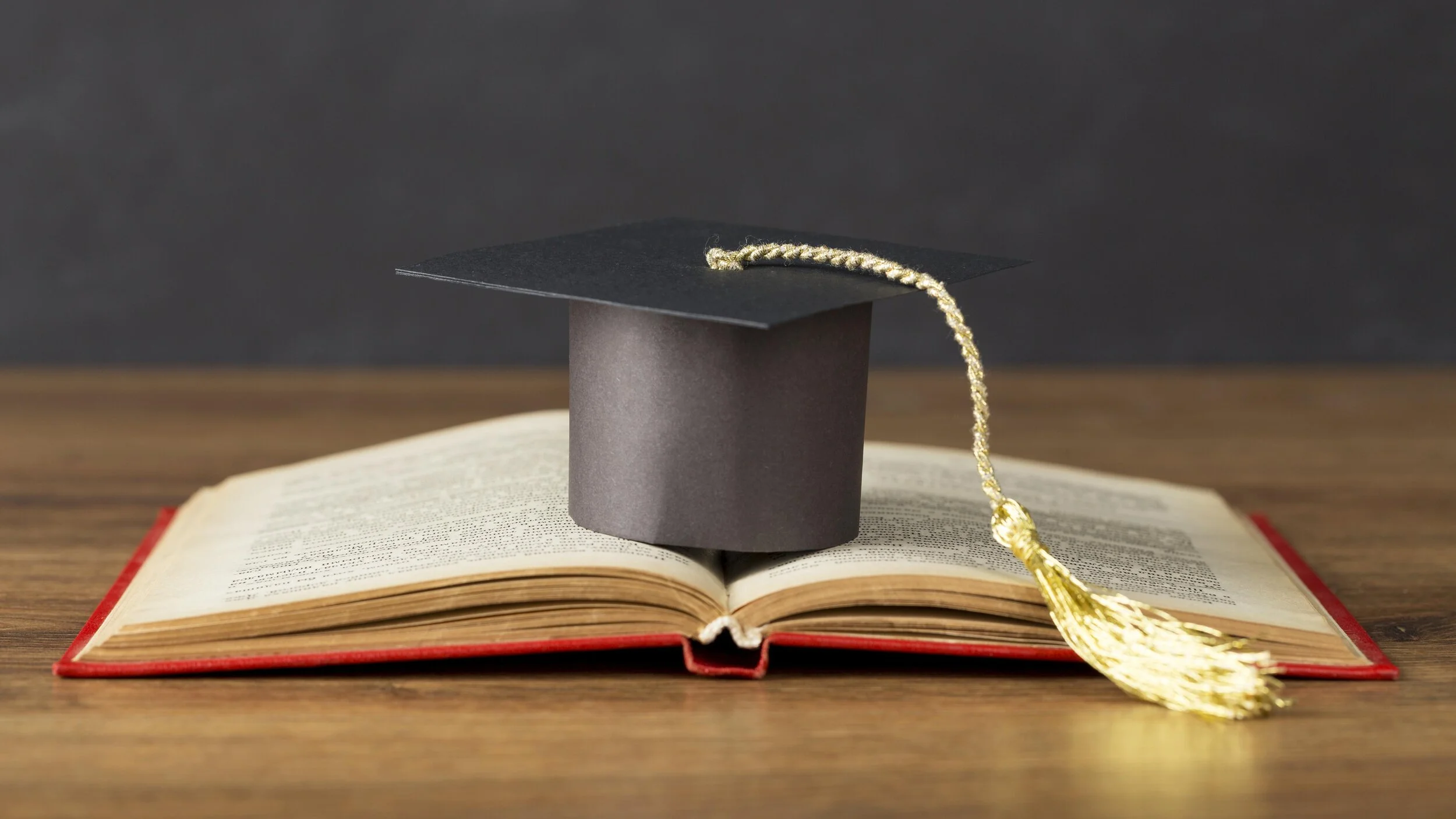 education-day-composition-with-graduation-cap.jpg