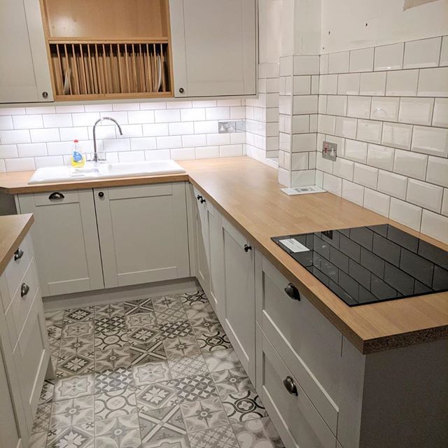 A recently completed kitchen installation with floor and wall tiling by @l.gtiling