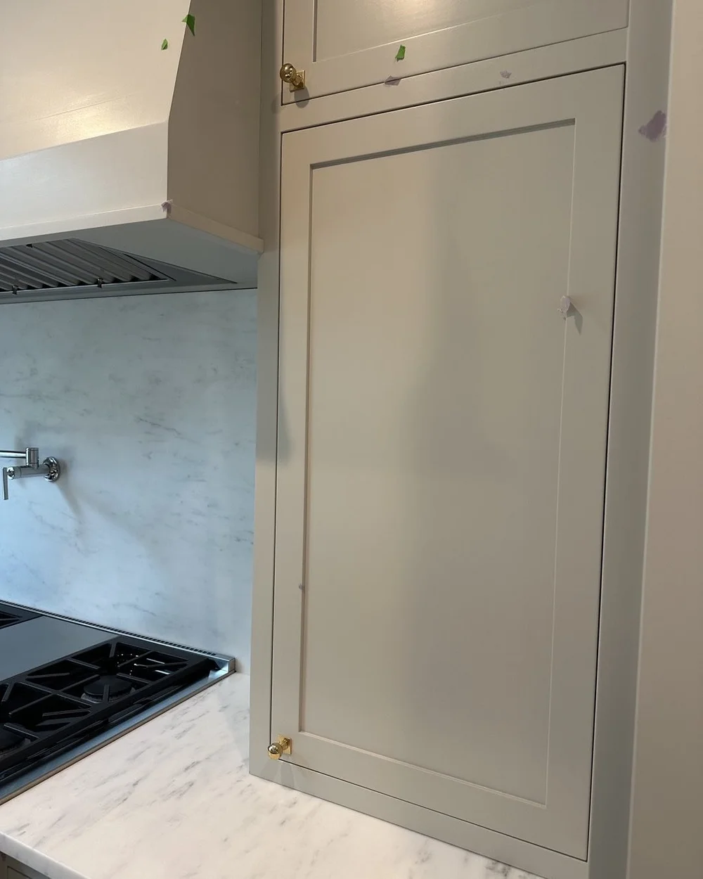 Trying on hardware for size as we punchlist