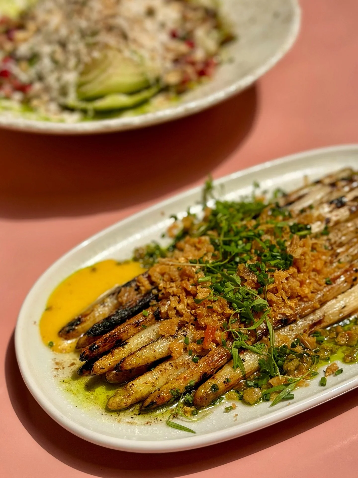 White asparagus season is one of those blink-and-you'll-miss-it moments.

Grilled Ontario white asparagus, lemon &amp; anchovy butter, crispy chicken skin crumble, and egg yolk gel.

A little rich, a little salty, and only around for a short time.
Ju