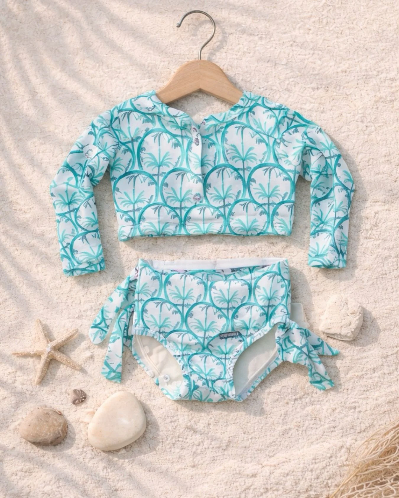 Designed for sunny days and little adventures by the sea. 🌿☀️

Soft, comfortable and made to move &mdash; because every detail matters when it comes to your little one.

From beach mornings to golden sunsets, this is more than swimwear&hellip; it&rs