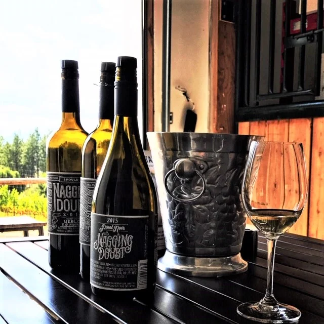 Nagging Doubt artisanal wines bear handcrafted labels chalked by Dana Tanamachi