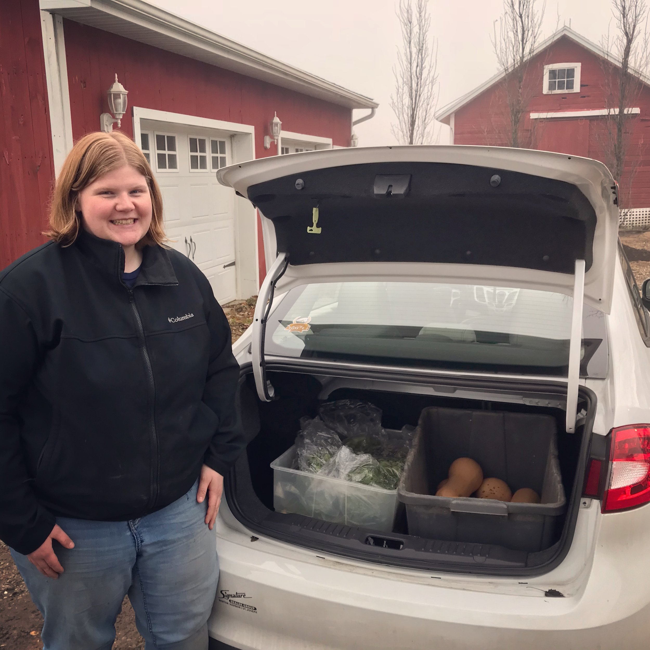  Mary from Harbor Country Mission picking up some early December produce 