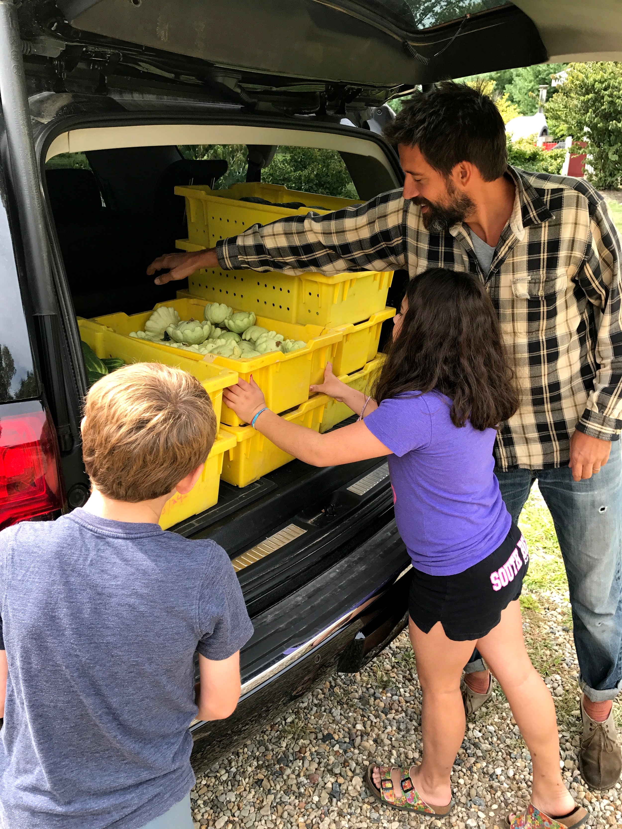 Farmer Billy and the Harris twins loading up a late summer produce donation