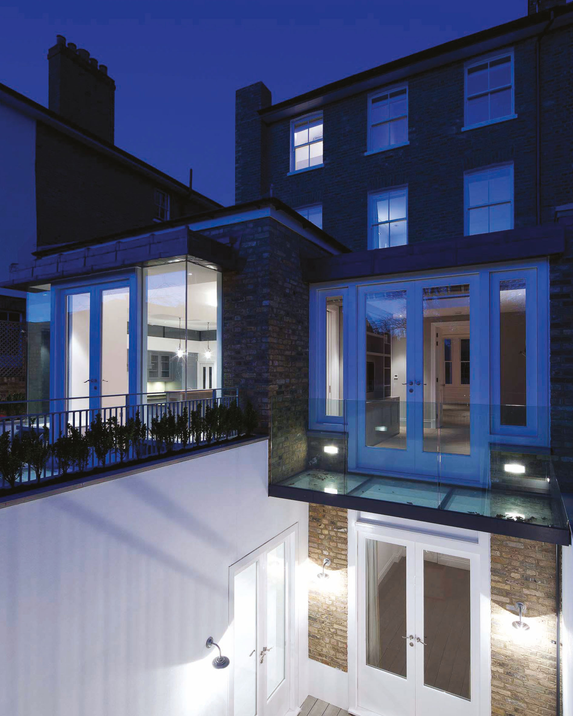 The garden elevation to the property. Spread over four floors with key architectual elements light up by contempoary bright lighting.