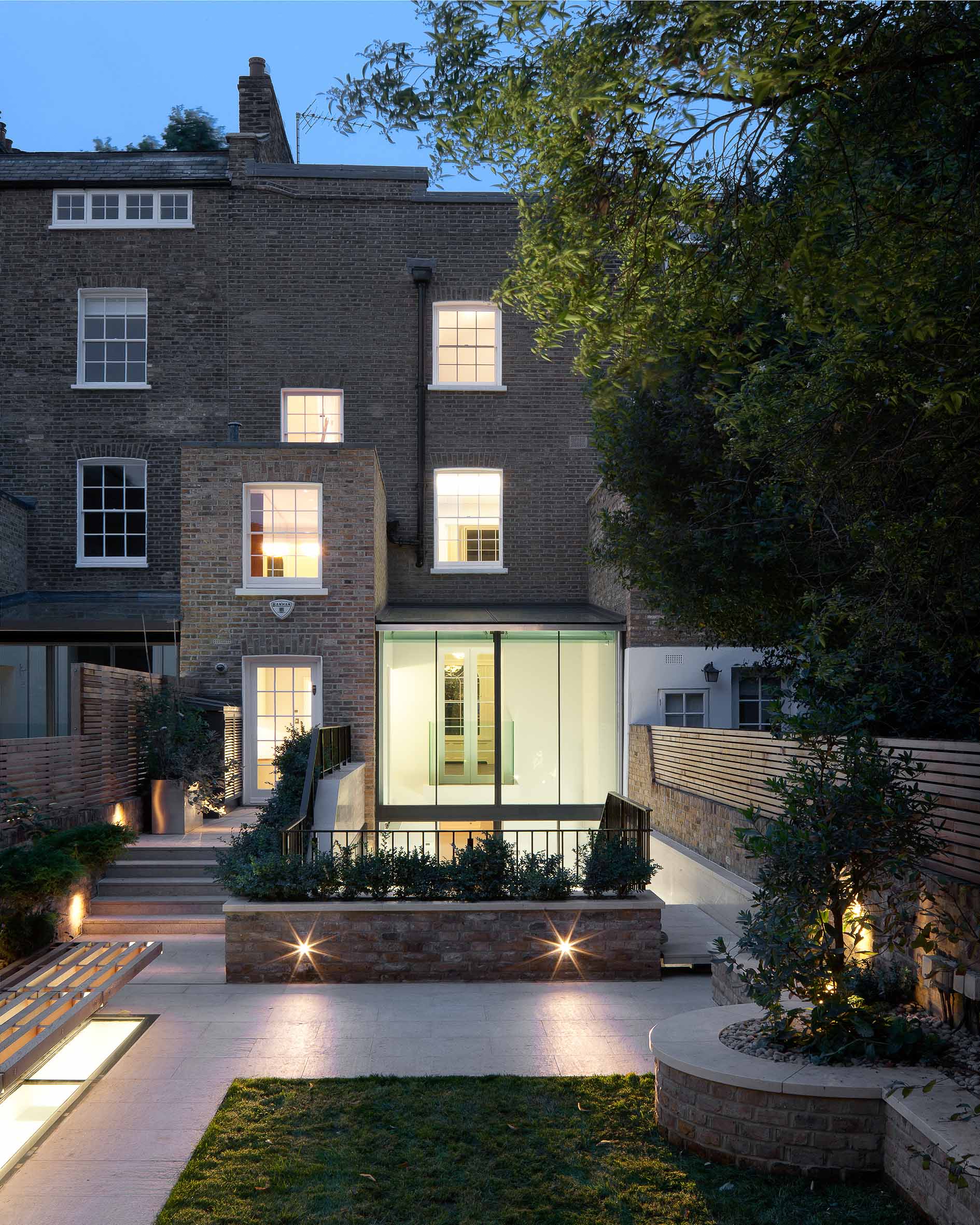 The landscaped garden view towards the rear of the property at dusk