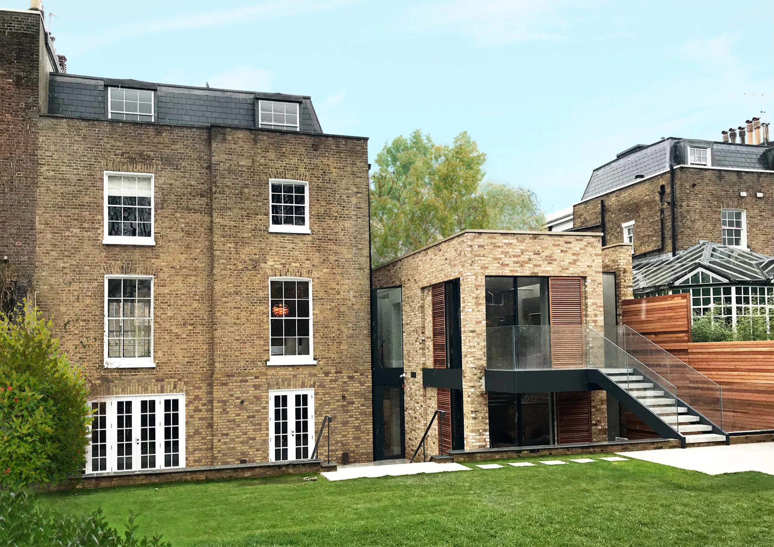 Stuart Forbes have designed a contemporary extension to this grade II listed property. A new wing on the side of the building contains a new kitchen on the first floor and living space on the ground floor. The basement will contain a gym and cinema room.