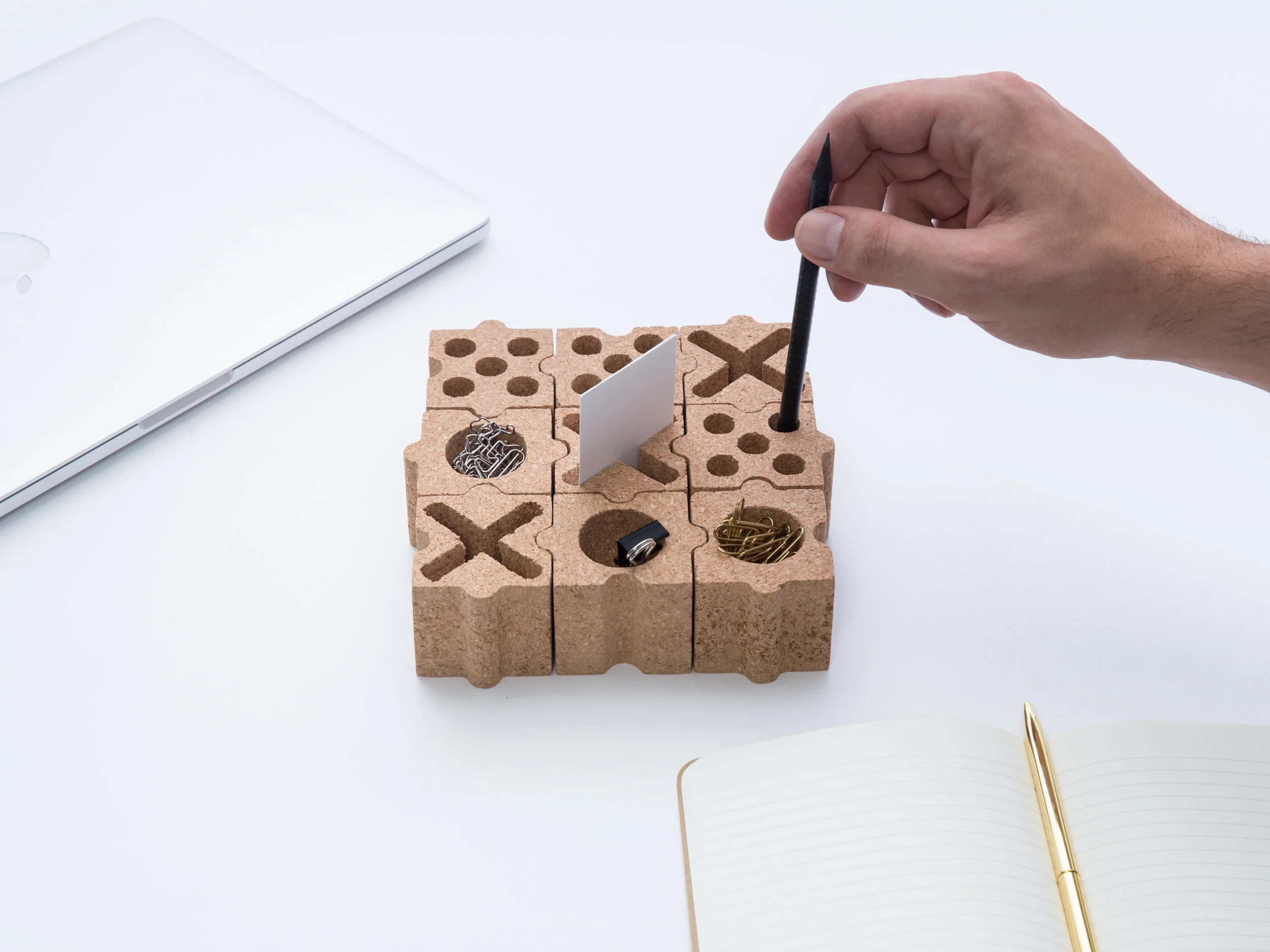  Tic-Tac-Toe turns the well-known game from paper to a functional desk organizer . The 9-piece puzzle set, each made of cork blocks, can split and combine into many arrangement. It is ideal to hold your pens, pencils,&nbsp;scissors, rulers, and deli