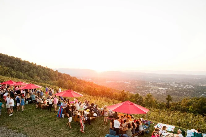 Revelers ogle a sunset at Carter Mountain. Hope you kept your eclipse glasses. Photo courtesy of content ChilesFamilyOrchard.com.