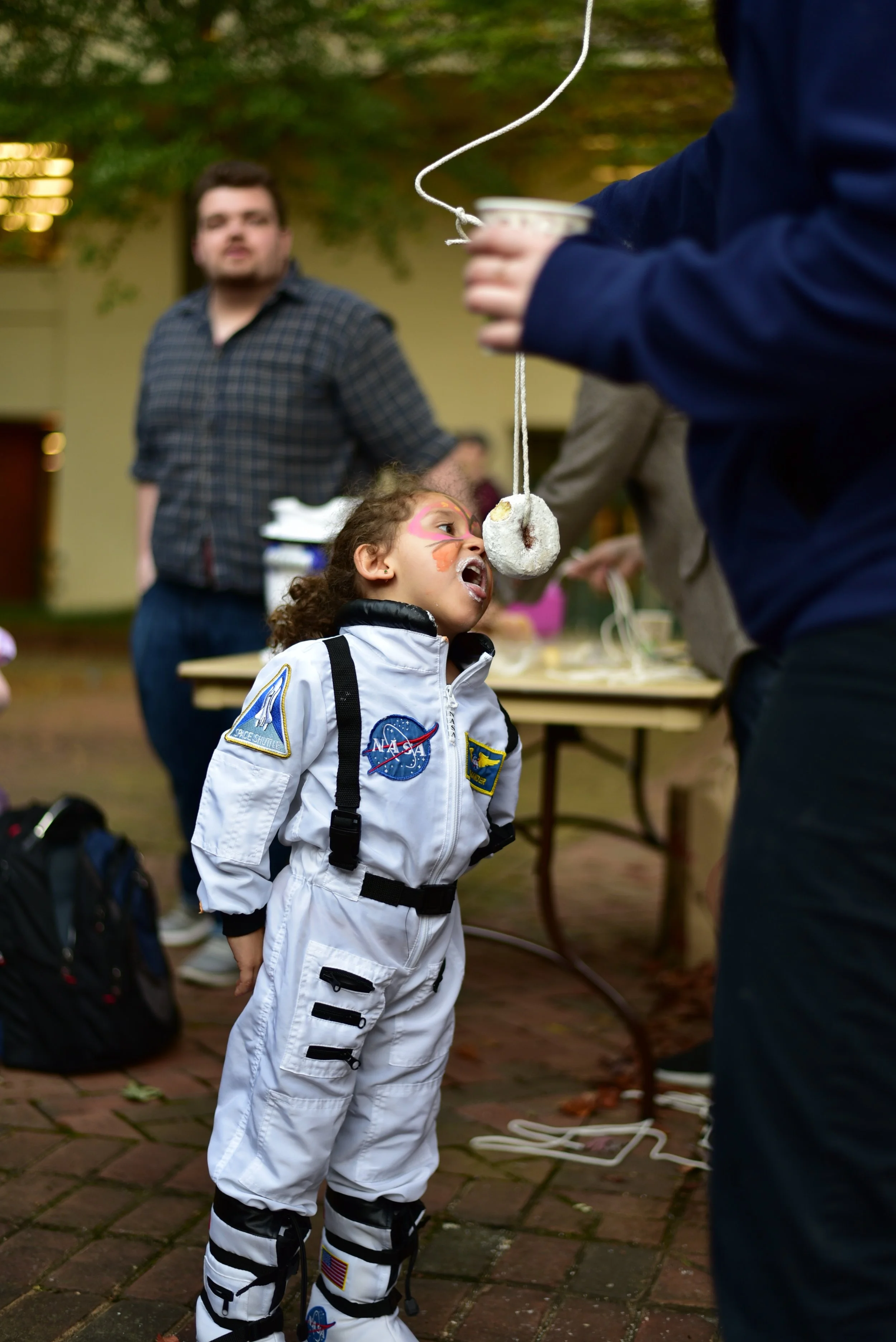 Cdr. Emma Ospina trains with a donut in anticipation of a zero gravity environment. Photo courtesy of Eric Hall.