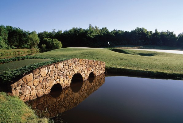 A lonely bridge extends accross a hazard at Birdwood Golf Course. Photo courtesy Virginia Golf Vacations.
