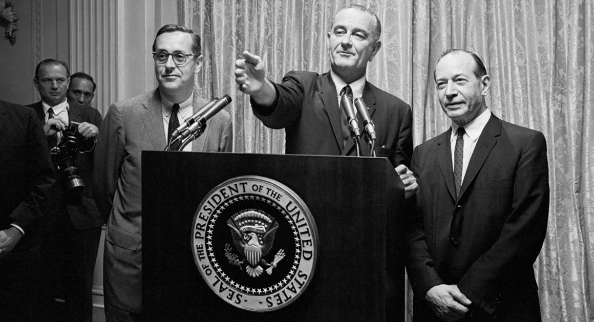 President Johnson takes questions at a press conference, flanked by Justice Fortas (right). Photo courtesy the AP.