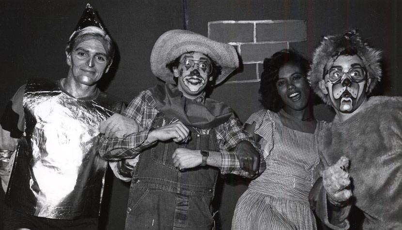 A production number on “The Wizard of Oz” featured Bernie Feord ‘88 as the Tin Man (Professor Charles Goetz); Fred Wagner ‘87 as the Scarecrow (Professor Michael Dooley); Mikki Graves (now Wasler) ‘88 as Dorothy (Professor Mildred Robinson); Mike Callahan ‘88 as the Lion (Professor Cal Woodard). Photo Credit law.virginia.edu.