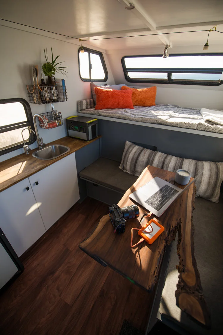 The living space looks more like a luxury tiny house than the typical expedition camper.