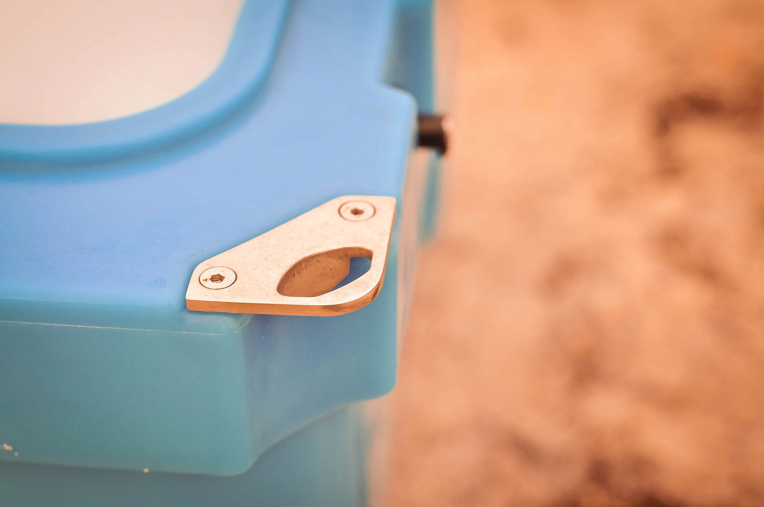 The padlock pass-through doubles as a bottle opener.