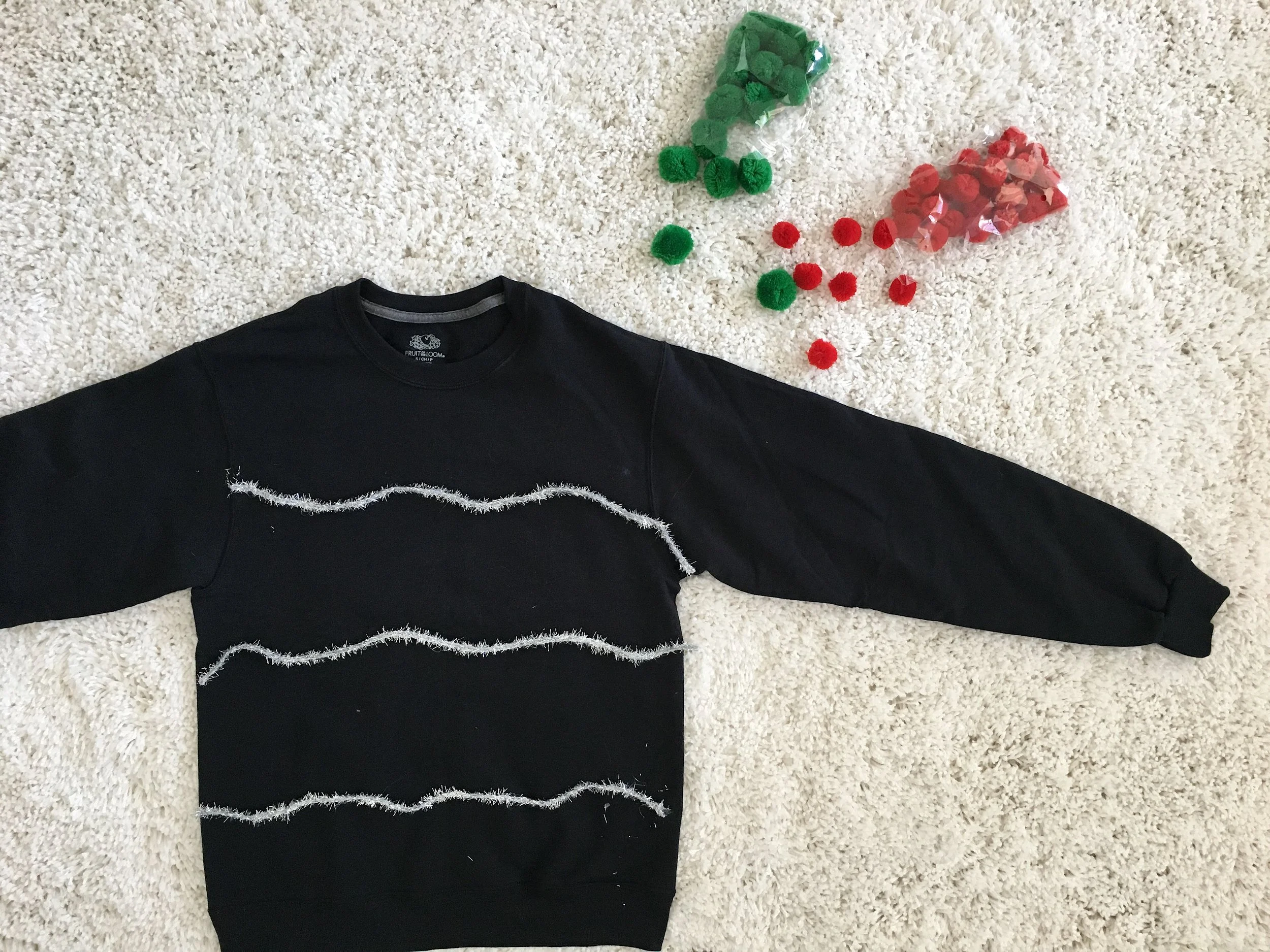 Black Christmas sweater with silver garland