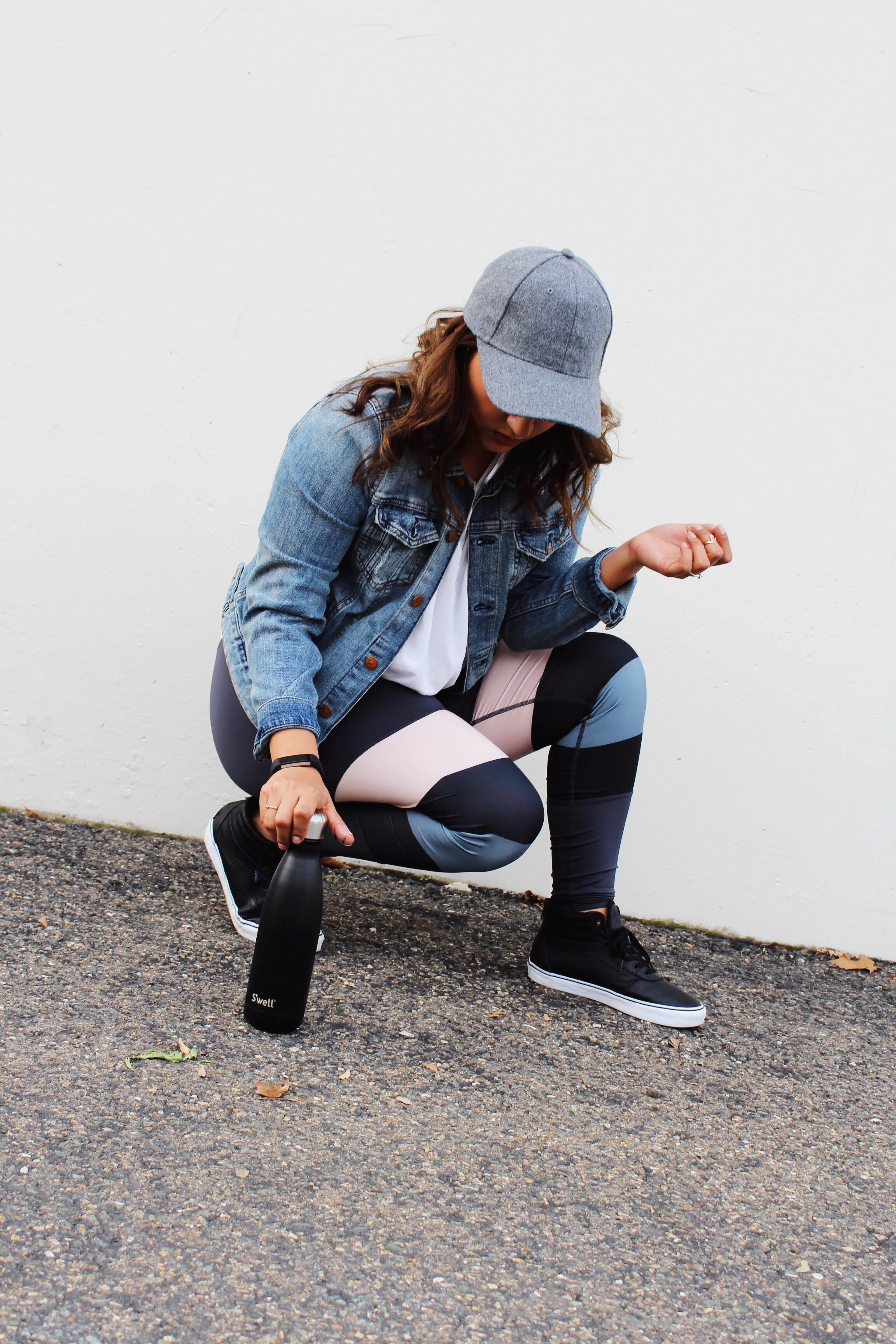 Grey Wool Baseball Cap with a denim jacket and stripped yoga pants. Swell Bottle and Black Pleather SK8- Hi Vans 