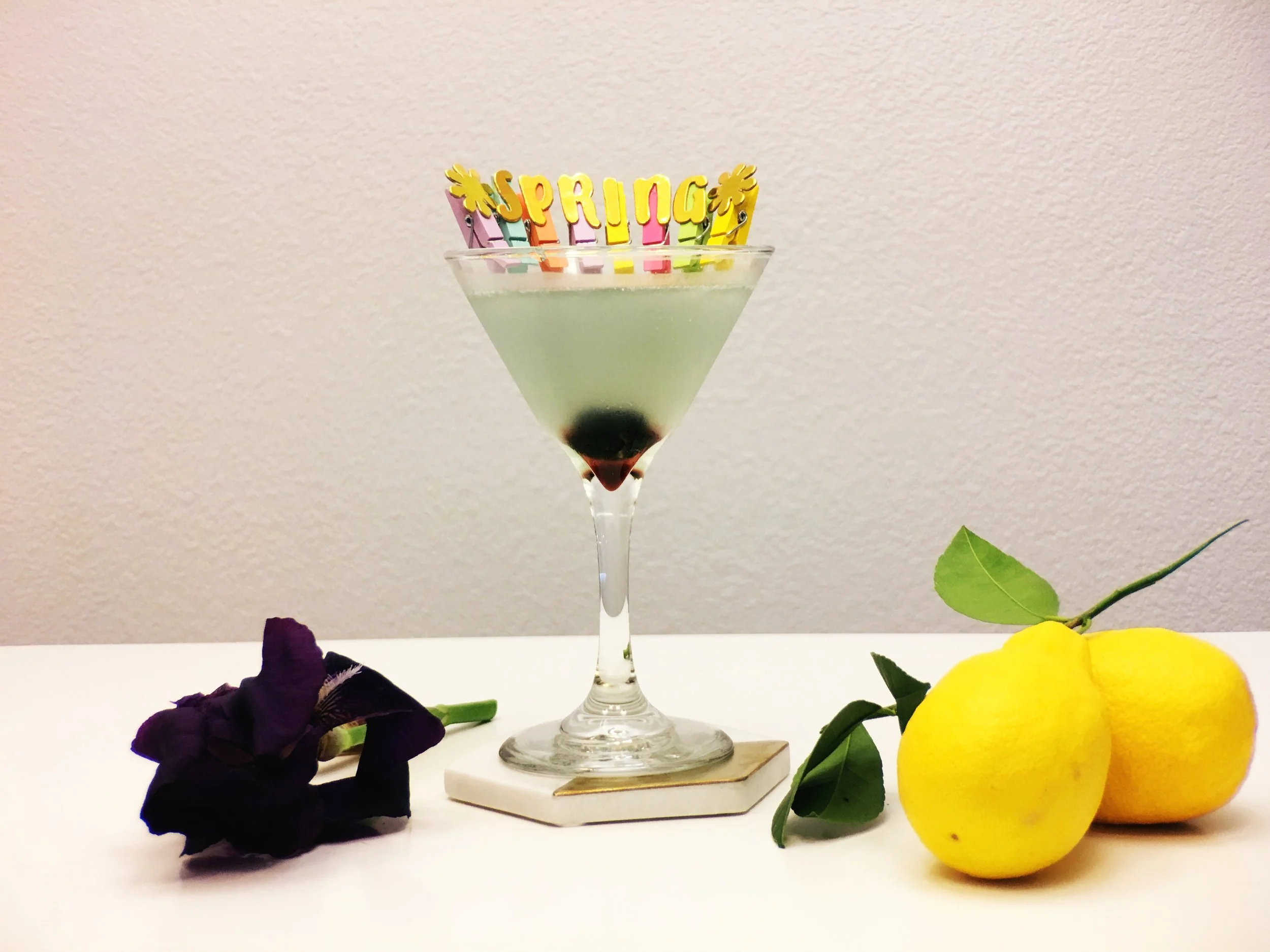 The Aviation Cocktail has blue color with a Luxardo Maraschino Cherry Garnish that drops to the bottom in a martini glass. 
