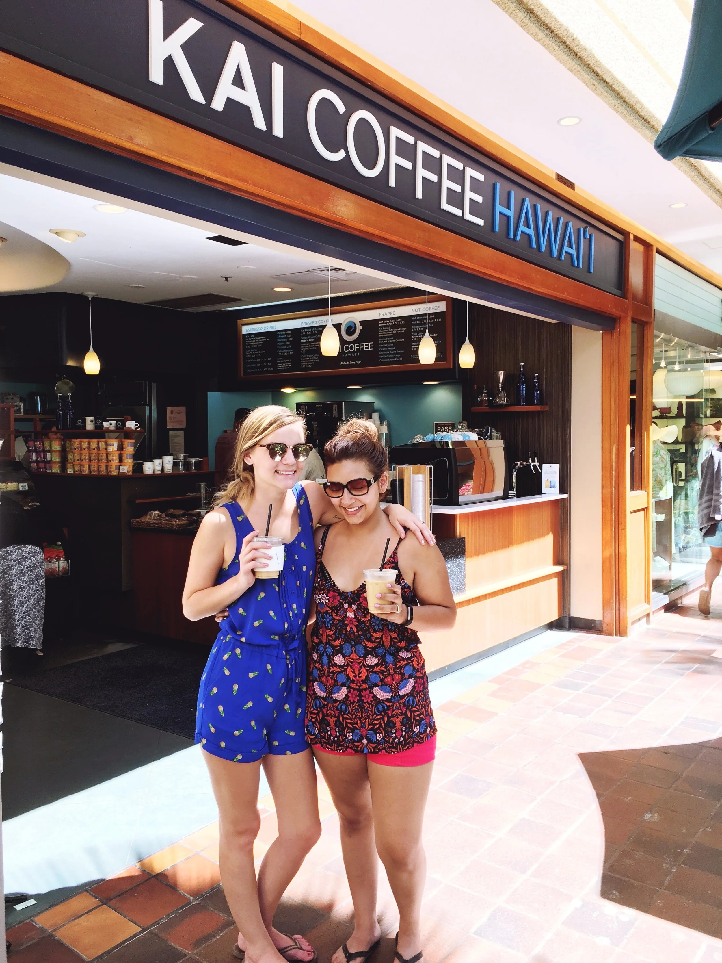 BFF's having Kai Coffee Lattes in Hawaii wearing tropical inspired clothing. 