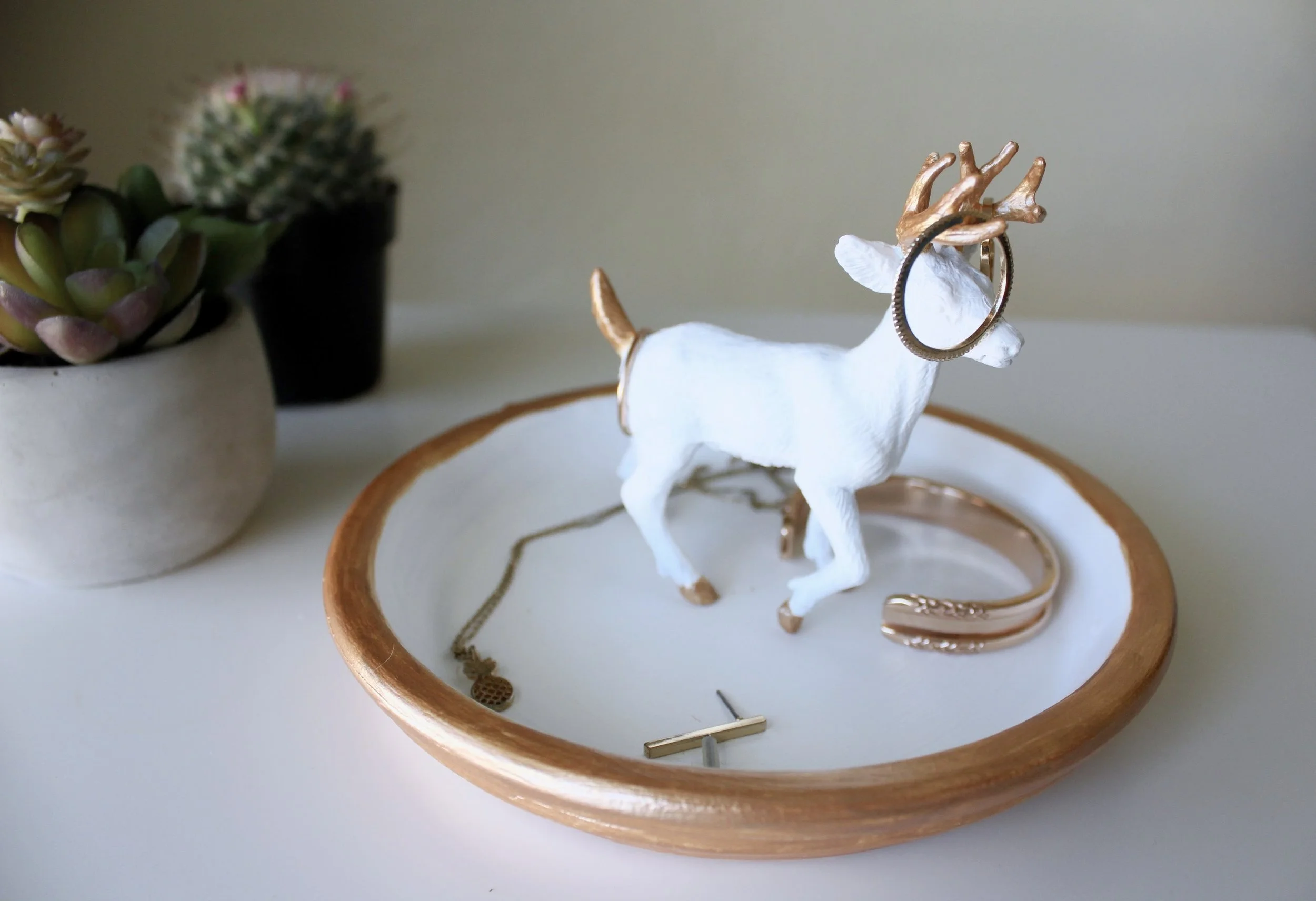 Succulent and Cactus displayed with a finished DIY Jewelry Dish with a Deer Figurine. Gold Jewelry Displayed including Maria Shireen Floral HairTie Bracelet. 