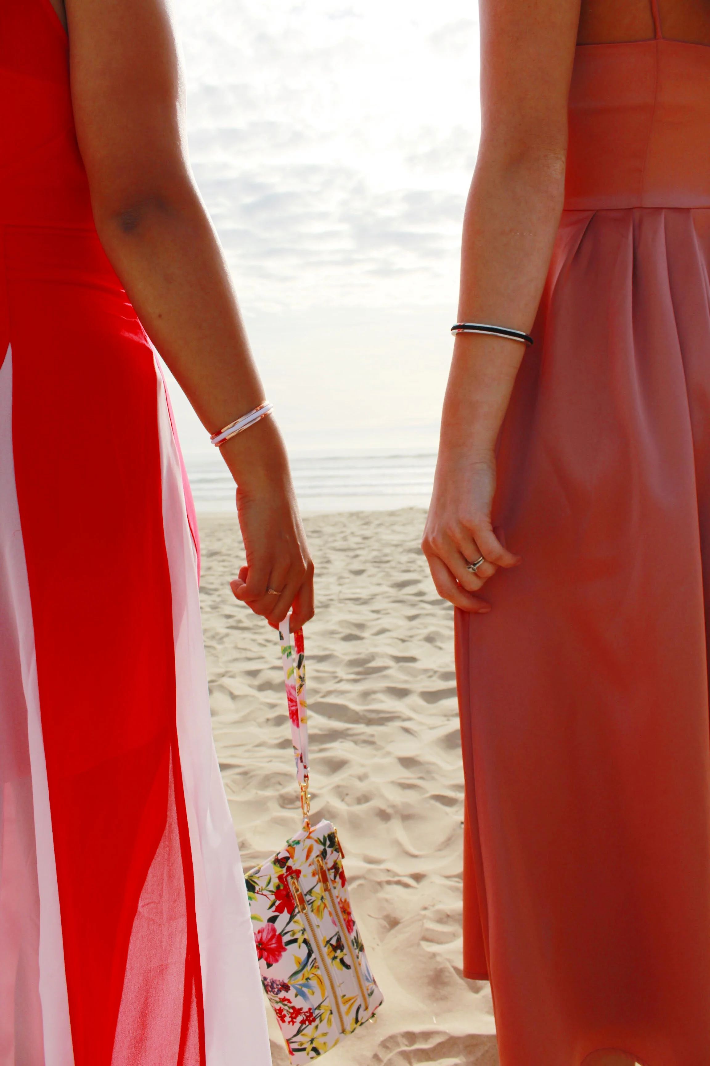 Wedding Guest Attire includes long dresses and a floral wristlet. 
