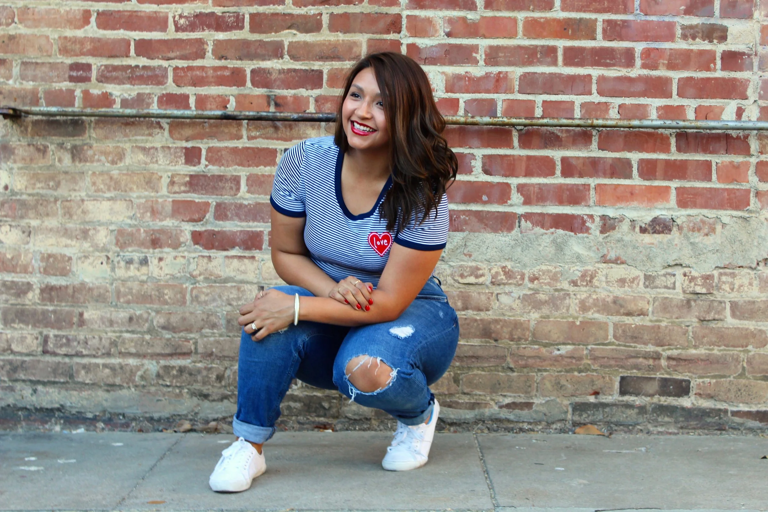 Blue and White Striped Ringer Tee with a Love Embroidered Heart Shaped Patch and Girlfriend Distressed Denim Jeans. 