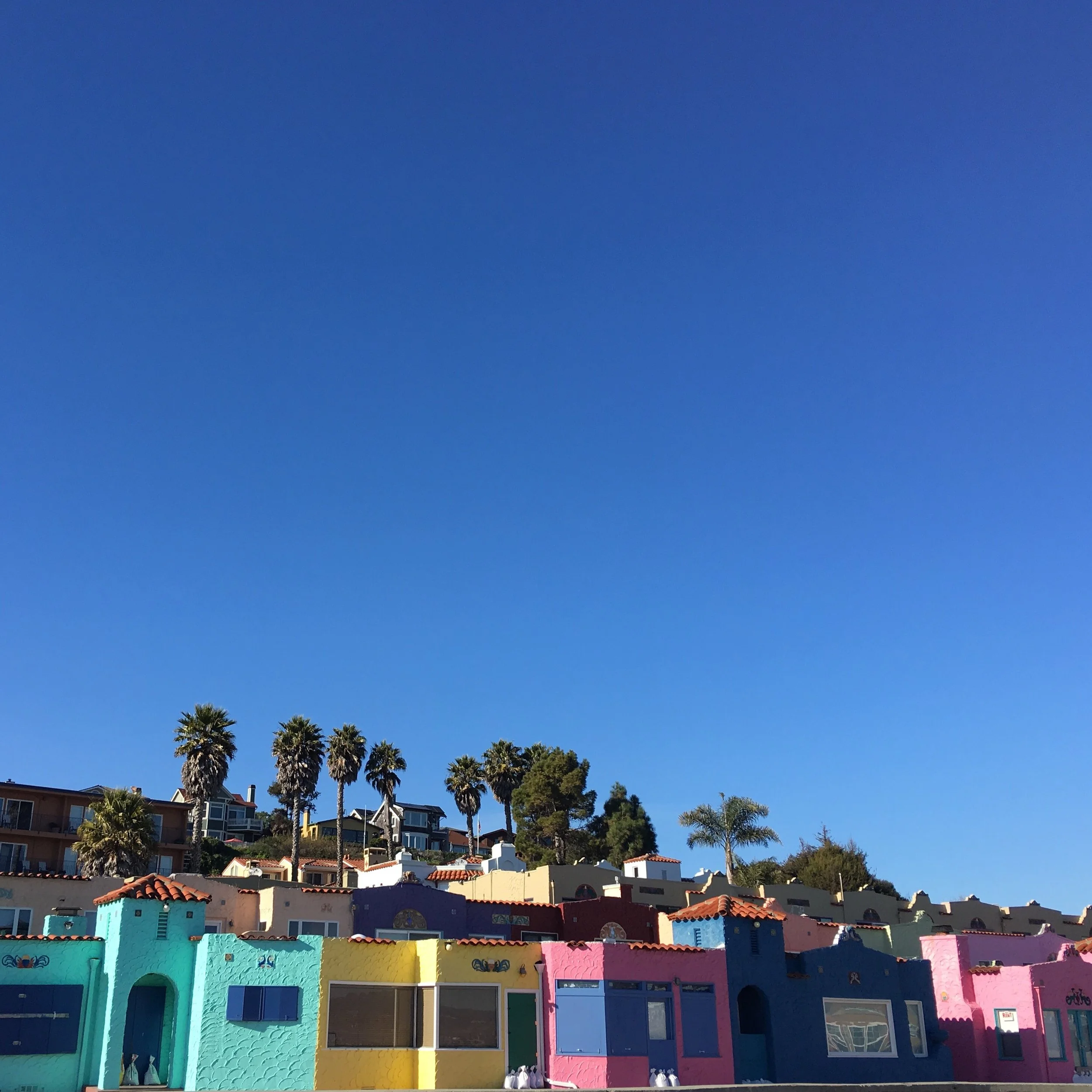 The Venetian Hotel at the Capitola Wharf in California. Bright Colorful Beach Buildings 