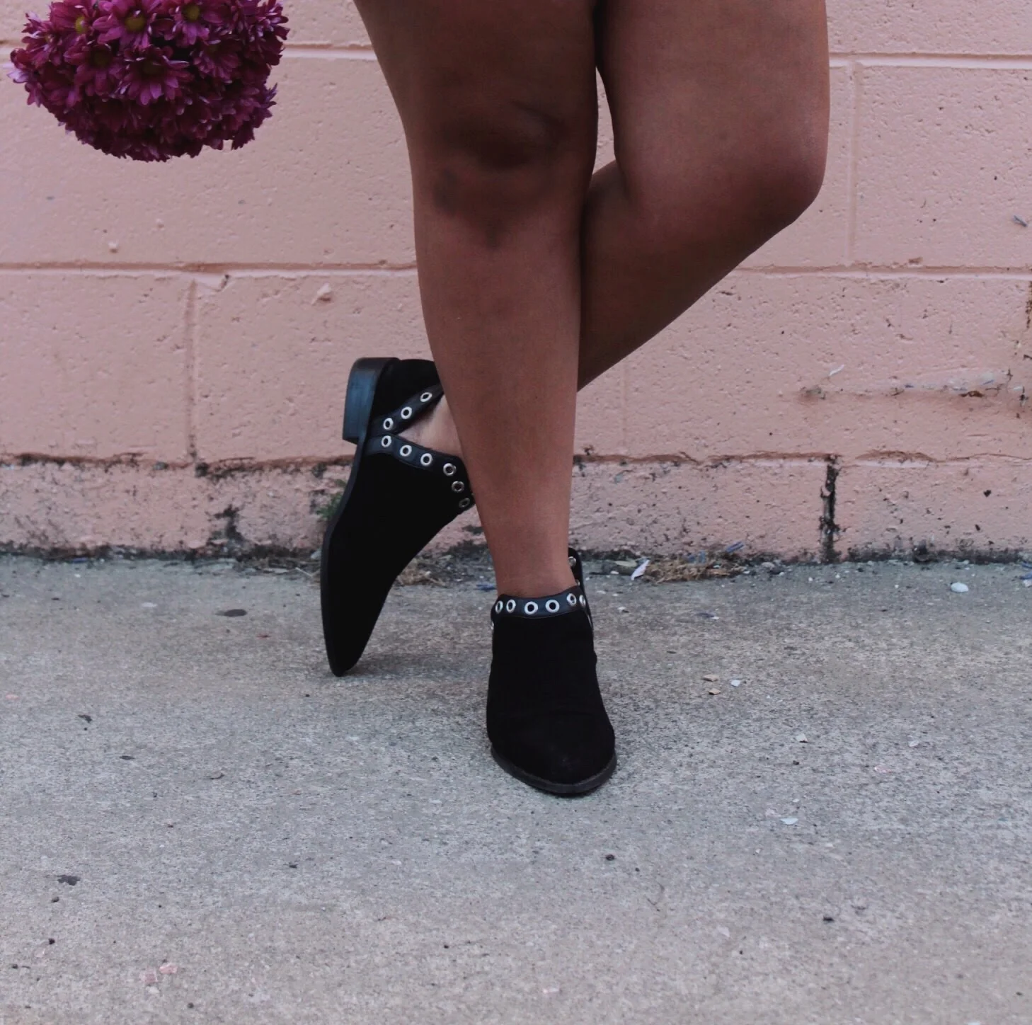 Black Ankle Boots with Eyelet Details and Purple Carnations. 