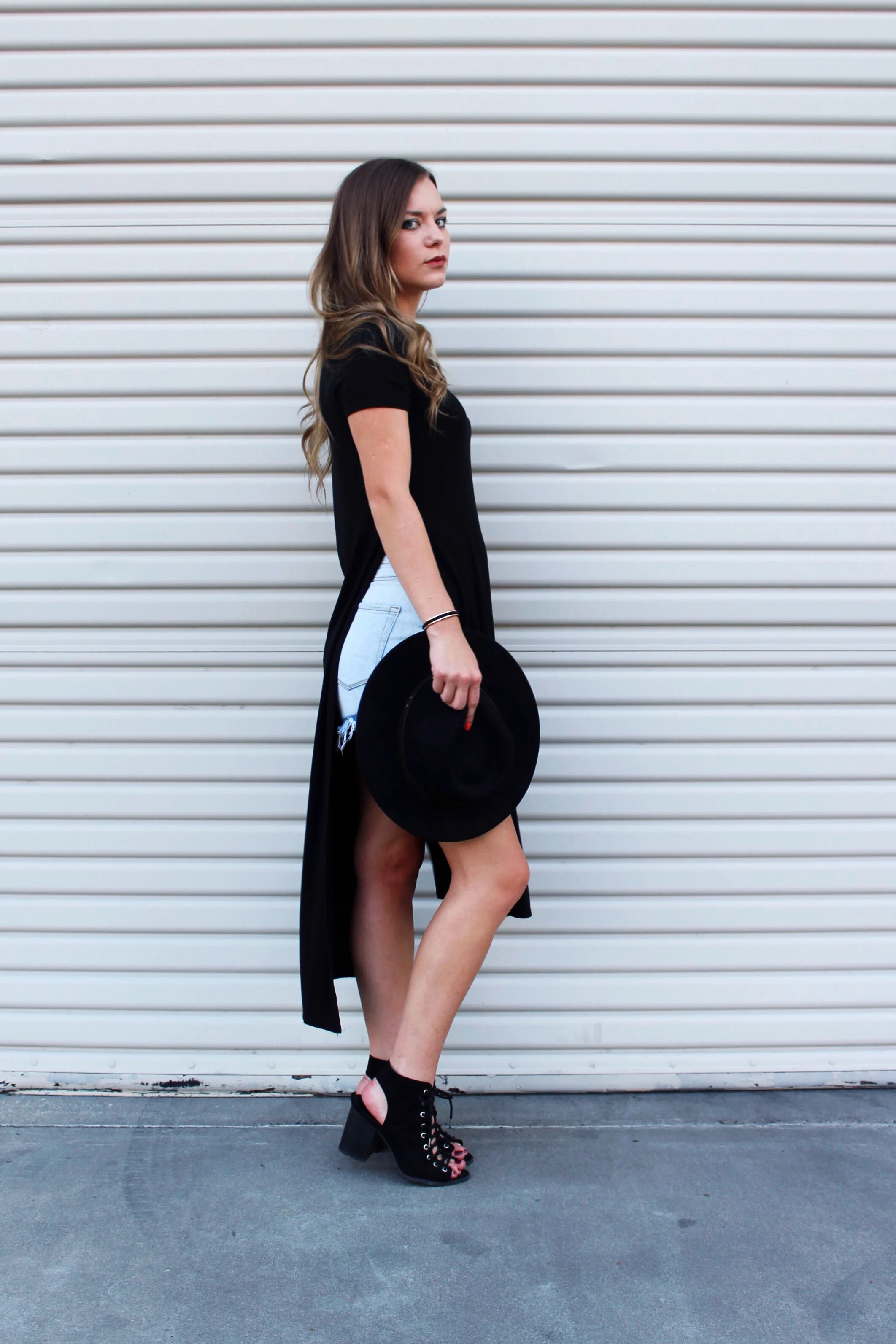 Black Tee Shirt Dress with Slits and Light Blue Denim Shorts. Thrifted Outfit. 