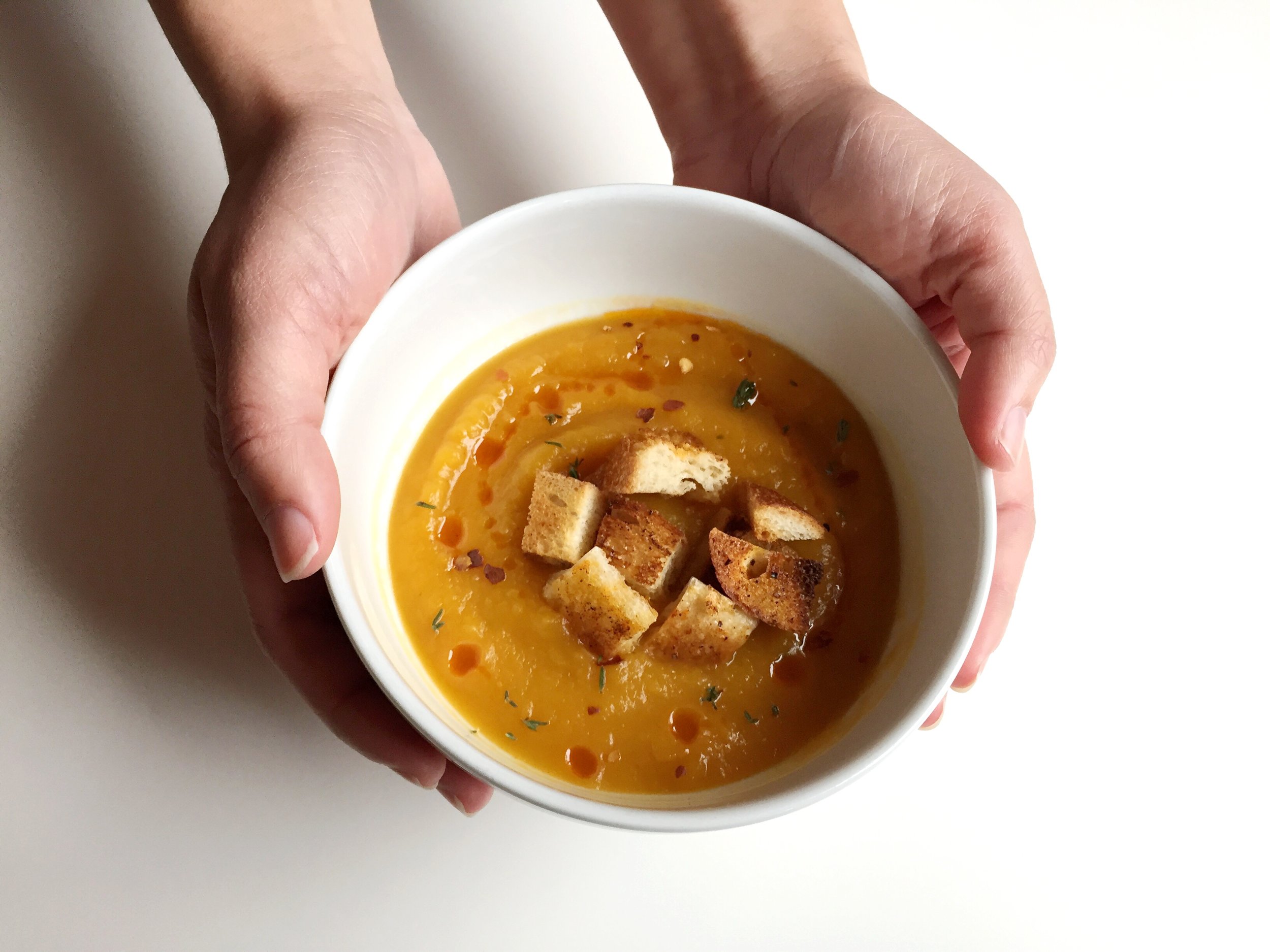 Roasted butternut squash soup with hot chili oil, chili flakes, and spicy croutons. We LOVE spicy!