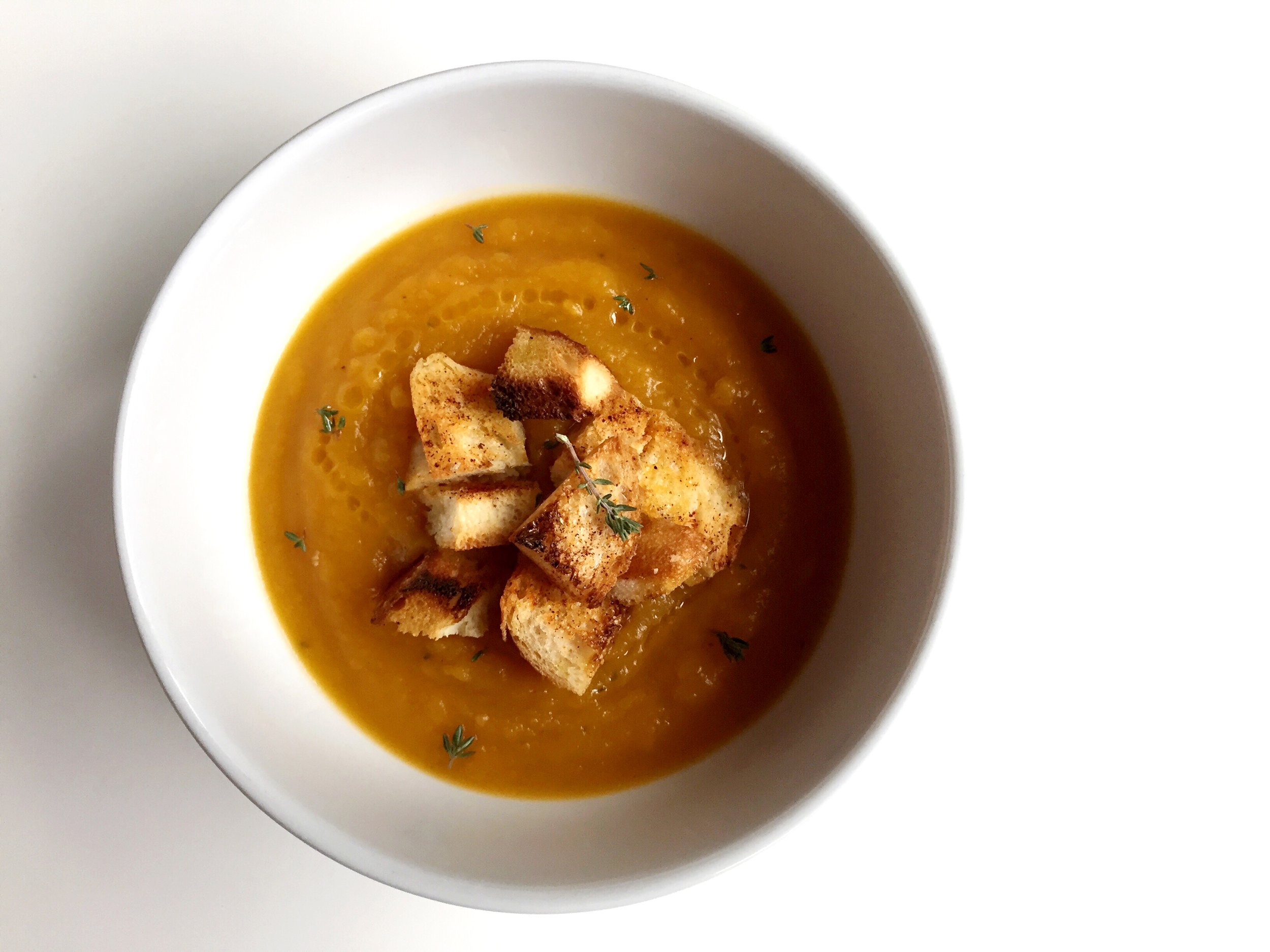 Roasted Butternut Squash soup with spicy croutons & lemon olive oil