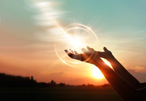  Woman hands praying for blessing from god on sunset background 