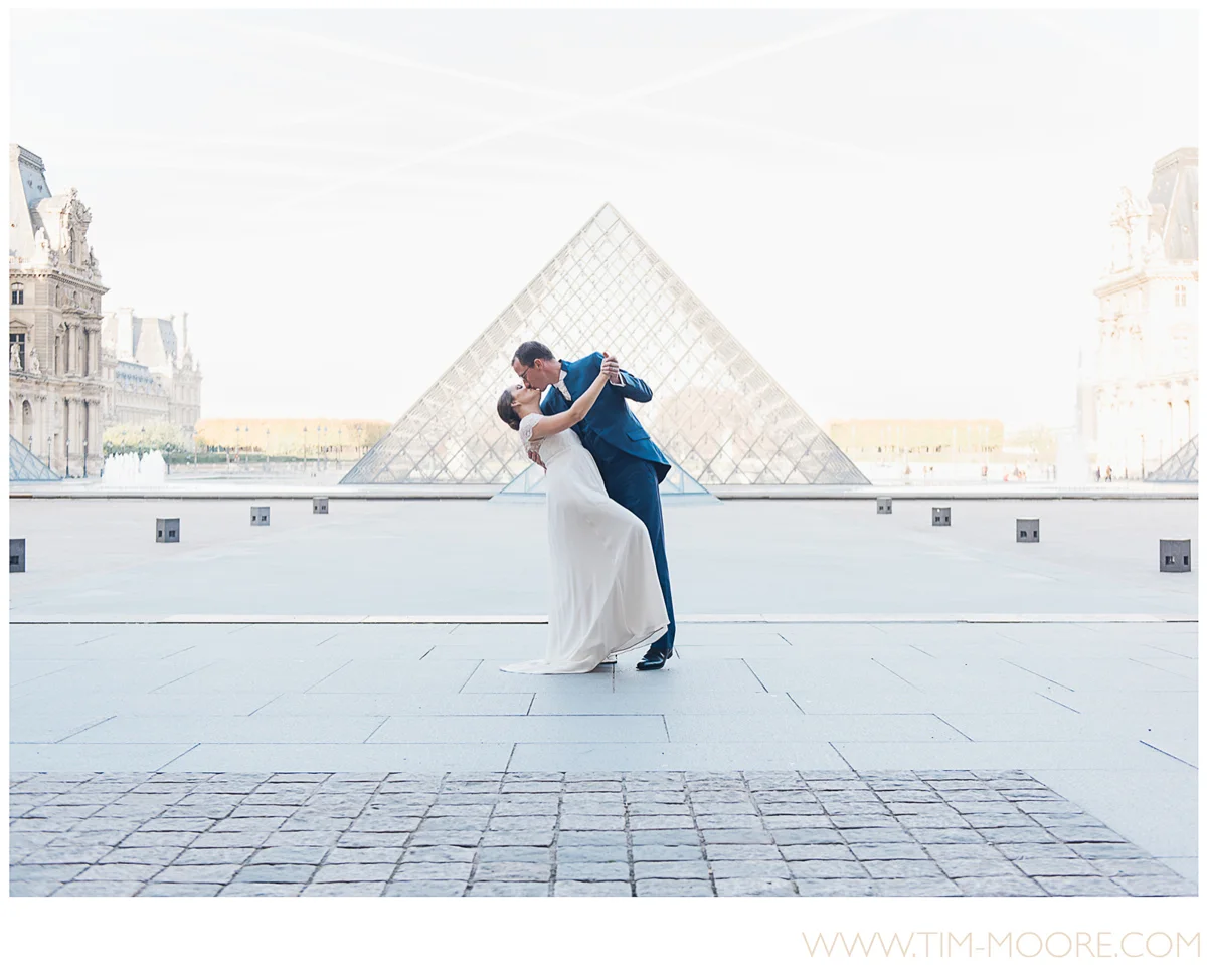 Paris photographer Tim Moore - Perrine and Boris dancing and kissing at the Louvre museum in Paris a few weeks after their Wedding