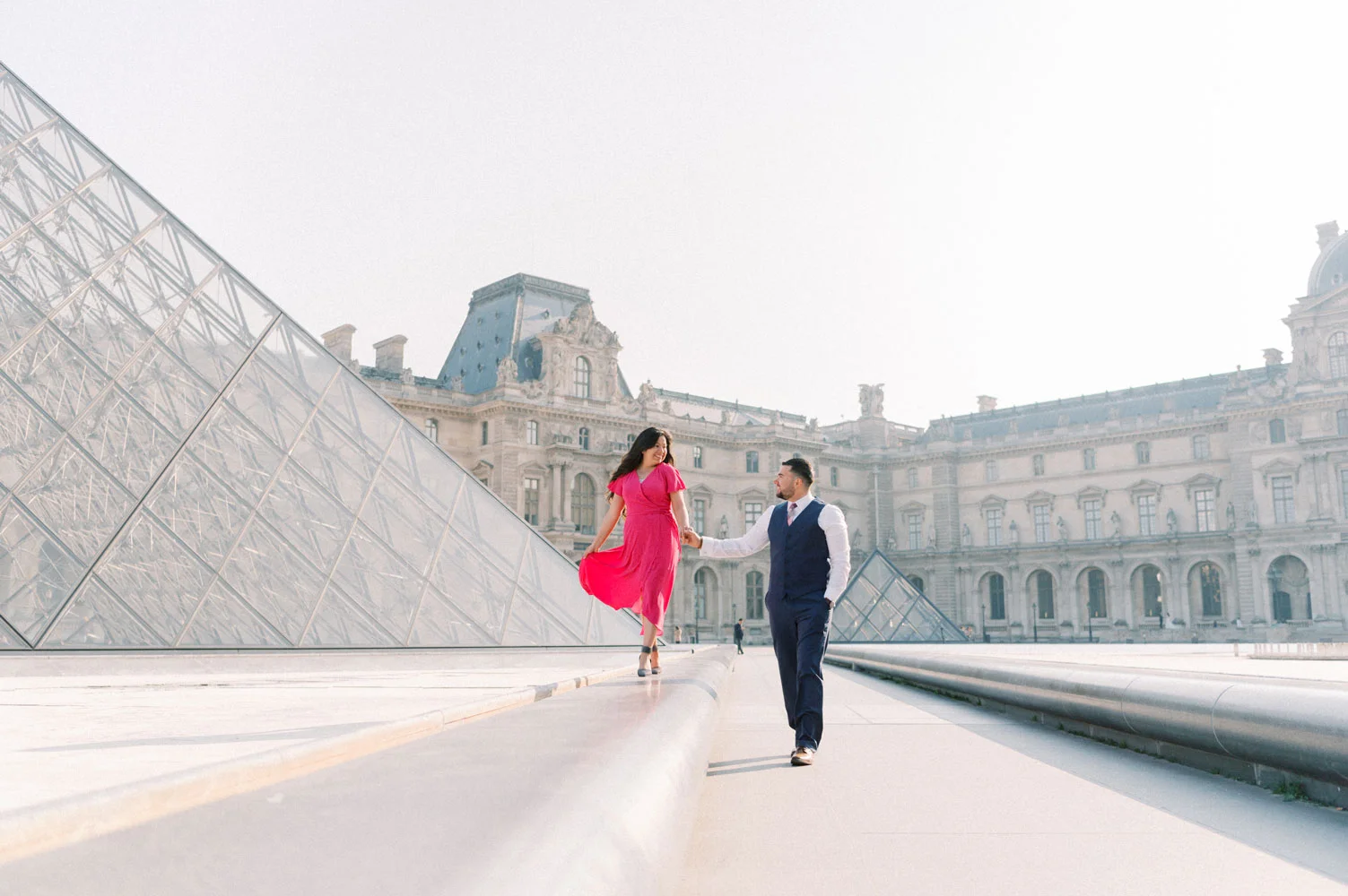 Paris Photographer Tim Moore with our lovely couple having the time of their lives at the Louvre Museum during their photo session in Paris.