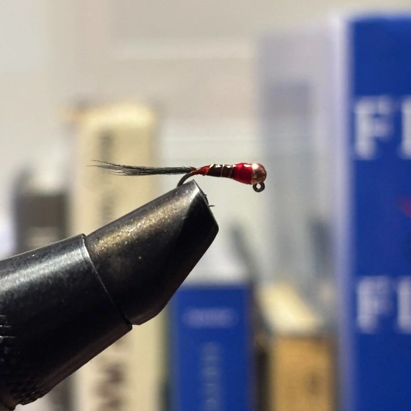 Winter's First Fly

As I lean back in the chair at my tying bench, I am surrounded by old fly pattern books, spools of thread, feathers, and memories. The warmth of the wood stove settles comfortably into the room as the first real snowstorm of the s