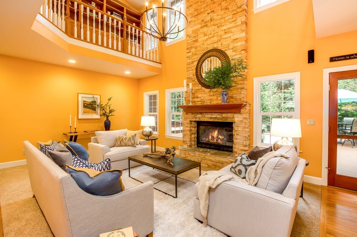  A marvelous great room opens to the kitchen and the outdoor living areas. It is wired for surround sound with a carpeted seating area and dramatic stacked stone propane fireplace with hardwood mantel and raised stone hearth. 